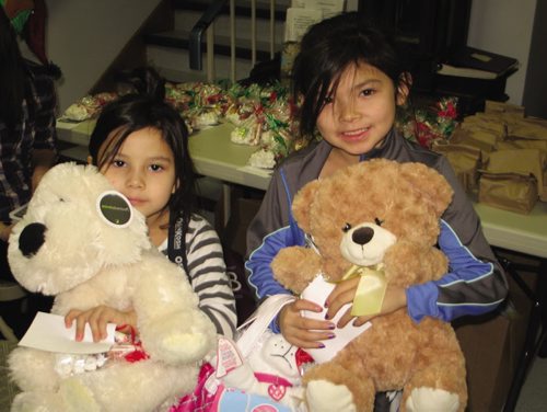 Canstar Community News Dec. 13, 2013 - Ciarra (left)and Kaydence Lambert with their new stuffed animals. (JARED STORY/THE TIMES/CANSTAR COMMUNITY NEWS)