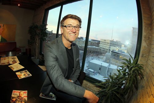 Peter George poses for a photo on the 5th floor of the Crocus Building on Main St. The story is about Winnipeg's largest advertising agency rebranding itself from McKim Cringan George to McKim. BORIS MINKEVICH / WINNIPEG FREE PRESS January 8, 2014