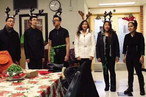 Canstar Community News Employees at the Winnipeg School Division's administration building are serenaded by the jazz choral group from Sisler High School before kicking off the Stuff the Bus campaign. (JORDAN THOMPSON)