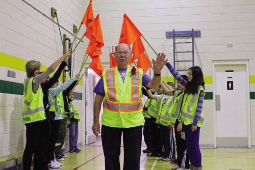 Canstar Community News George Drad receives a hero's welcome at Beaumont School, where he was receiving a "Canada's Favourite Crossing Guard" award. (JORDAN THOMPSON)