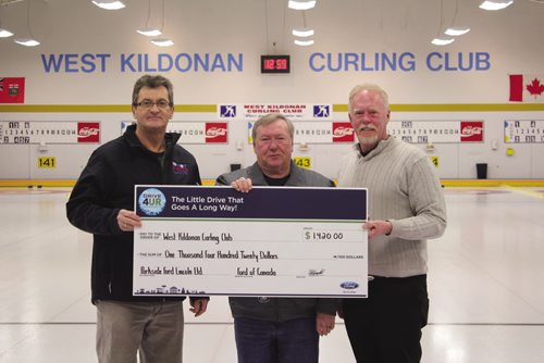 Canstar Community News Dec. 31, 2013 - Parkside Ford Lincoln's Mel Campbell (centre) and Don Thomas (right) present West Kildonan Curling Club president Dennis Koroluk with a $1420 cheque, the proceeds from its Drive 4 UR Community event. In November, community members test drove Ford vehicles to raise money for the curling club. (SUPPLIED/THE TIMES/CANSTAR COMMUNITY NEWS)