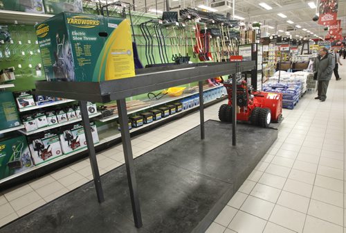 At left is the snow blower display that normally shows 12 different models, on Thursday only one is on display at the Canadian Tire Store on Regent Ave. W.    For intern story on hot selling items during cold snap and snow fall.    Wayne Glowacki / Winnipeg Free Press Jan.9  2014