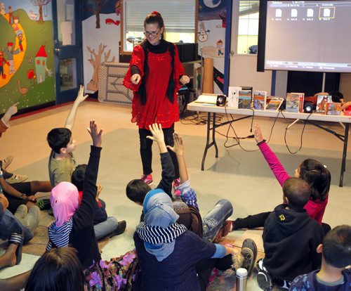 Author Anita Daher reads and interacts with kids at IRCOM.  BORIS MINKEVICH / WINNIPEG FREE PRESS January 9, 2014