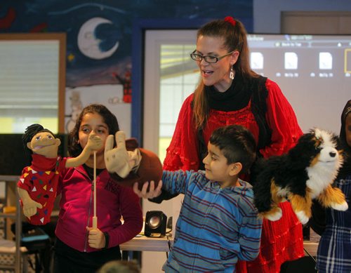 Author Anita Daher reads and interacts with kids at IRCOM. Kids names are Faiza Malik and Yahya Malik. BORIS MINKEVICH / WINNIPEG FREE PRESS January 9, 2014