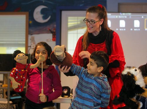 Author Anita Daher reads and interacts with kids at IRCOM. Kids names are Faiza Malik and Yahya Malik. BORIS MINKEVICH / WINNIPEG FREE PRESS January 9, 2014