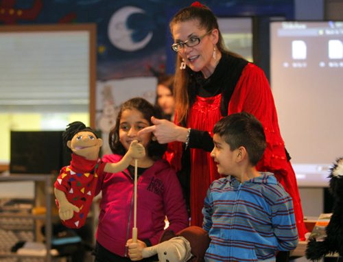 Author Anita Daher reads and interacts with kids at IRCOM. Kids names are Faiza Malik and Yahya Malik. BORIS MINKEVICH / WINNIPEG FREE PRESS January 9, 2014