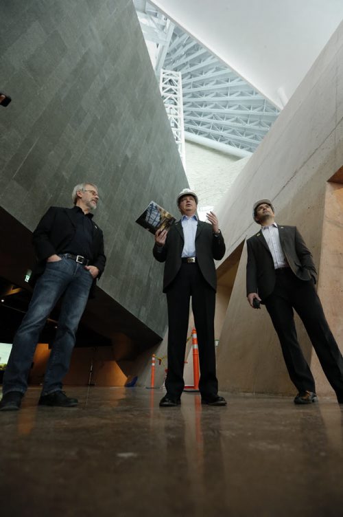 The Builders LtoR  Ron Martin , Todd Craigen and Brendon Hollier  lead the tour shown in front entrance  with complex  geometric  basalt stone and concrete in background . In the open ,  grand ,geometric design of the  2nd level Garden of Contemplation  is evident as the public ascends from the darkness of the first floor. The builders of the complex structure are almost finished and the preparations for  the exhibits  are about to start . WINNIPEG Äì¬January 10 2014 Äì The designers and builders of the Canadian Museum for Human Rights (CMHR) held a  media tour on Friday, January 10, to showcase a remarkable achievement in building design and construction. Not in photo Sean Barnes, vice president and district manager for PCL Construction, and Scott Stirton, CEO of Smith Carter Architects and Engineers, will make opening remarks with  architects who brought Antoine PredockÄôs complex design to life to create a stunning Canadian architectural icon. JAN. 10 2014 / KEN GIGLIOTTI / WINNIPEG FREE PRESS