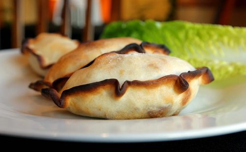 Restaurant Review - Simon's. Empanada (meat with raisin and olives). 513 St Mary's Road. BORIS MINKEVICH / WINNIPEG FREE PRESS January 10, 2014