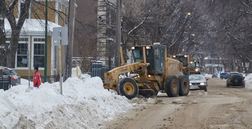 Crews were still out Saturday afternoon clearing streets in Wolseley.   140111 January 11, 2014 Mike Deal / Winnipeg Free Press