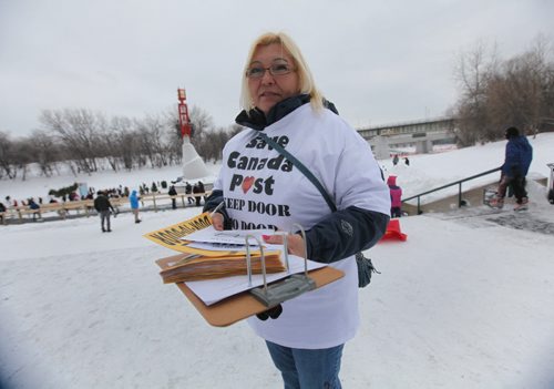 Canada Post Letter Carrier Cheri Villard asks visiter's to The Forks Market if they would sign a petition to keep door to door letter service on Saturday afternoon. Jan 11,, 2014 Ruth Bonneville / Winnipeg Free Press