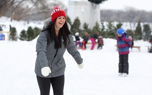 Danielle Procyshyn laughs as she makes her way onto the new Red River Mutual Trail on the Assiniboine River at the Forks Saturday afternoon.  Hundreds of  Winnipegers made their way down to the river to enjoy the newly opened river trail and the balmy winter weather.  Jan 11,, 2014 Ruth Bonneville / Winnipeg Free Press
