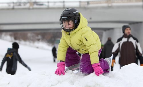 Six-year-old Zoey Purvis plays on a hill near the newly opened Red River Mutual Trail on the Assiniboine River at the Forks Saturday afternoon. to enjoy the balmy winter weather.  Jan 11,, 2014 Ruth Bonneville / Winnipeg Free Press