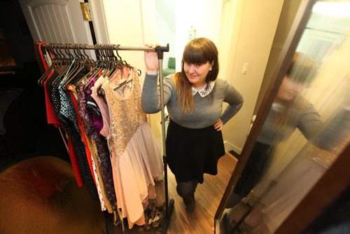 Jodie Layne  poses next to a rack of femmine, stylish clothing and a dusty full length mirror near her dressing room. She is a local feminist/activist who learned to love her body for what it is and is part of a local body/fat acceptance movement. It's sort of an antidote to all the weight loss messaging in January. Jan 11,, 2014 Ruth Bonneville / Winnipeg Free Press