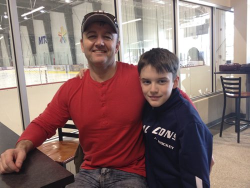 Rob Gibson and his son, Ethan, say Winnipeg's status as a 'hockey town' means fans have high expectations of their NHL team. JAMES TURNER/WINNIPEG FREE PRESS January 12, 2013