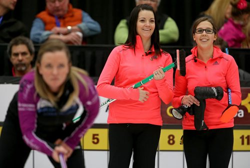 Kerri Einarson laughs with Selena Kaatz as Chelsea Carey instructs her sweepers early in the final of the Scotties Provincial Curling Championship at the Tundra Oil & Gas Place in Virden, Manitoba, Sunday, January 12, 2014. (TREVOR HAGAN/WINNIPEG FREE PRESS)