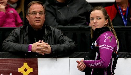 Coach and father, Dan Carey, speaking with Chelsea Carey as she faces Kerri Einarson during the final of the Scotties Provincial Curling Championship at the Tundra Oil & Gas Place in Virden, Manitoba, Sunday, January 12, 2014. (TREVOR HAGAN/WINNIPEG FREE PRESS)