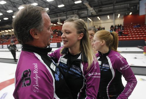 Father and coach, Dan Carey celebrates with Chelsea Carey after defeating Kerri Einarson in the final of the Scotties Provincial Curling Championship at the Tundra Oil & Gas Place in Virden, Manitoba, Sunday, January 12, 2014. (TREVOR HAGAN/WINNIPEG FREE PRESS)