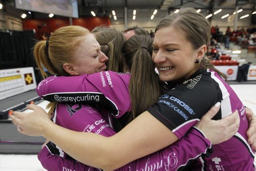Chelsea Carey, second from left, and her rink, Kristy McDonald, Lindsay Titheridge and Kristen Foster, celebrate after defeating Kerri Einarson in the final of the Scotties Provincial Curling Championship at the Tundra Oil & Gas Place in Virden, Manitoba, Sunday, January 12, 2014. (TREVOR HAGAN/WINNIPEG FREE PRESS)