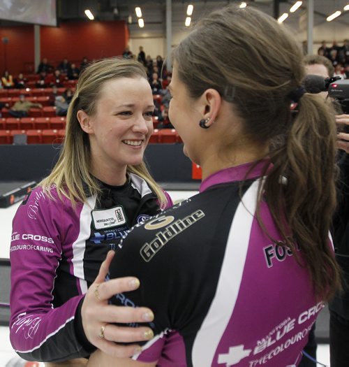 Chelsea Carey celebrates with Kristen Foster after defeating Kerri Einarson in the final of the Scotties Provincial Curling Championship at the Tundra Oil & Gas Place in Virden, Manitoba, Sunday, January 12, 2014. (TREVOR HAGAN/WINNIPEG FREE PRESS)