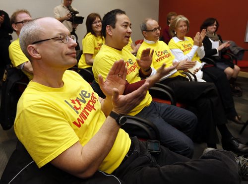 The One Heart Foundation members wearing yellow I Love Winnipeg t-shirts  were on hand to present Wpf Police a check for $20,000  for their endowment fund . The Winnipeg Police Service, with the assistance of The Winnipeg Foundation and One Heart Foundation, will be launching a new WPS Endowment Fund.  The launch will be held at 11:00 a.m. at the West District Station, 2321 Grant Avenue.Representatives in attendance are: Mayor, Sam Katz  ,Winnipeg Police Chief, Devon Clunis  , Winnipeg Police Service Board member, David Keam , Rick Frost, Chief Executive Officer, The Winnipeg Foundation ,Ron MacLean, One Heart Foundation . JAN. 13 2014 / KEN GIGLIOTTI / WINNIPEG FREE PRESS