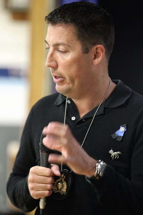 RCMP Constable Tad Milmine talks to a gym full of students at Grant Park High School about growing up a victim of bullying.  140113 - January 13, 2014 MIKE DEAL / WINNIPEG FREE PRESS