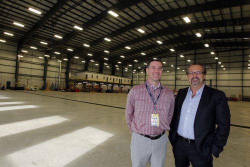 The new Calm Air hangar where several planes can fit in and be worked on. (L-R) Calm Air President Gary Bell and Exchange Income Corp. CEO Mike Pyle.  BORIS MINKEVICH / WINNIPEG FREE PRESS January 14, 2014