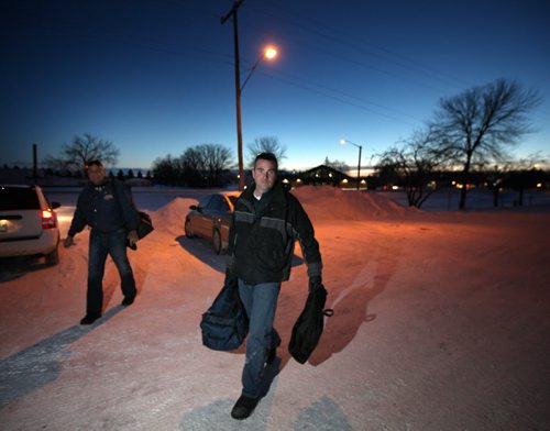 Basketball referee's Wayne Banfield (left) and Stewart McKenzie travel rural manitoba regularly in all types of weather to officiate matches in high school gyms. Here they arrive at the Carman Collegiate. See Nick Martin story. January 14, 2014 - (Phil Hossack / Winnipeg Free Press)