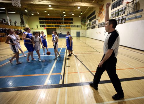 Basketball referee's Wayne Banfield and Stewart McKenzie travel rural manitoba regularly in all types of weather to officiate matches in high school gyms. Stewart makes a call at a match between the Carman Cougars and the Gretna Blues. See Nick Martin story. January 14, 2014 - (Phil Hossack / Winnipeg Free Press)