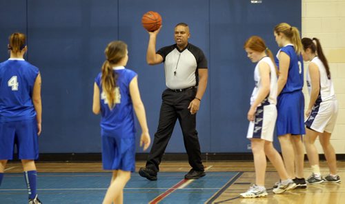 Basketball referee's Wayne Banfield and Stewart McKenzie travel rural manitoba regularly in all types of weather to officiate matches in high school gyms. Wayne Banfield starts the play between the Carman COugars and Gretna Blues. See Nick Martin story. January 14, 2014 - (Phil Hossack / Winnipeg Free Press)