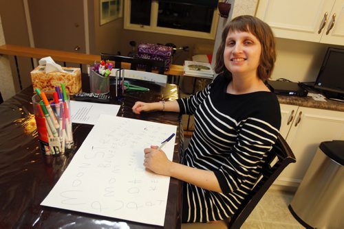 Melanie Halprin, 21, has autism and is non-verbal, except for reactive single words. Her family creates art cards with her works on it as thank you cards to give to people. One of these was sent to a friend in the Netherlands where it was seen by a local artist. Because the artist was impressed with her work, two pieces of Melanies art ended up being part of an art show in Amsterdam where something like 7,000 people saw it. BORIS MINKEVICH / WINNIPEG FREE PRESS January 15, 2014