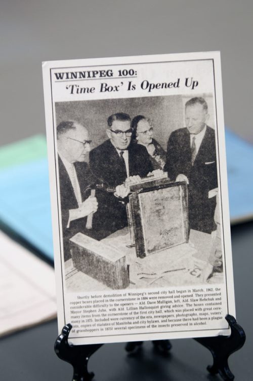 Newspaper article that shows officials opening casket that was that contained items from the early beginnings of Winnipeg as a city- See Randy Turner story- January 16, 2014   (JOE BRYKSA / WINNIPEG FREE PRESS)