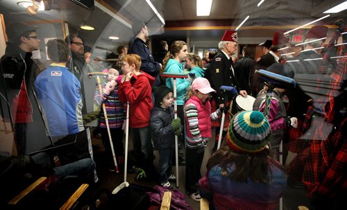 Curlers of all ages and gender crowd the waiting room at the Pembina Curling Club Thursday waiting for the opening ceremonies at the 126th Manitoba Open Bonspiel formerly the MCA Bonspiel. Melissa Martin's story. January 16, 2014 - (Phil Hossack / Winnipeg Free Press)