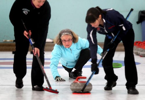 Former World Champion Chris Scalena of the THistle Club is flanked by her sweepers. She's part of an all female team in the newly "open" Manitoba Open Bonspiel formerly the MCA Bonspiel. Melissa Martin's story. January 16, 2014 - (Phil Hossack / Winnipeg Free Press)