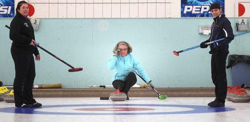 Former World Champion Chris Scalena of the THistle Club is flanked by her sweepers. She's part of an all female team in the newly "open" Manitoba Open Bonspiel formerly the MCA Bonspiel. Melissa Martin's story. January 16, 2014 - (Phil Hossack / Winnipeg Free Press)