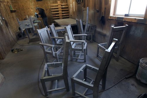 Prairie Barnwood in Morden, Manitoba  They make furniture out of old barnwood-Here employee Aaron Wiebe  works on table and chairs under construction-See Bill Redekop  story- Jan 14, 2014   (JOE BRYKSA / WINNIPEG FREE PRESS)