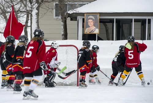 140118 Winnipeg - DAVID LIPNOWSKI / WINNIPEG FREE PRESS (January 18, 2014)  Bill Martens, 69, of McCreary Road in Charleswood has made a huge backyard hockey rink with seating for 1,000. He calls it the Charity Rink & Snow Bowl, and he is hosting games to fundraise for four charities. On Saturday the South Winnipeg Kings battled the Fort Garry Flyers.