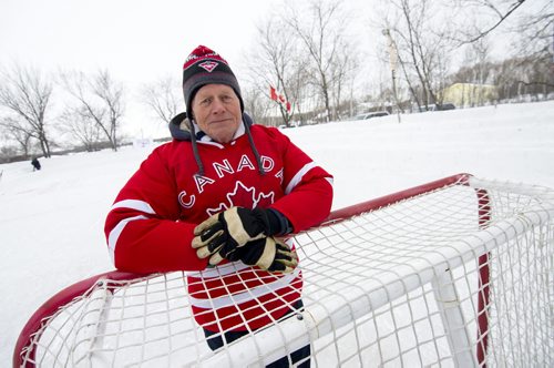 140118 Winnipeg - DAVID LIPNOWSKI / WINNIPEG FREE PRESS (January 18, 2014)  Bill Martens, 69, of McCreary Road in Charleswood has made a huge backyard hockey rink with seating for 1,000. He calls it the Charity Rink & Snow Bowl, and he is hosting games to fundraise for four charities. On Saturday the South Winnipeg Kings battled the Fort Garry Flyers.