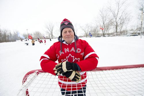 140118 Winnipeg - DAVID LIPNOWSKI / WINNIPEG FREE PRESS (January 18, 2014)  Bill Martens, 69, of McCreary Road in Charleswood has made a huge backyard hockey rink with seating for 1,000. He calls it the Charity Rink & Snow Bowl, and he is hosting games to fundraise for four charities. On Saturday the South Winnipeg Kings battled the Fort Garry Flyers.