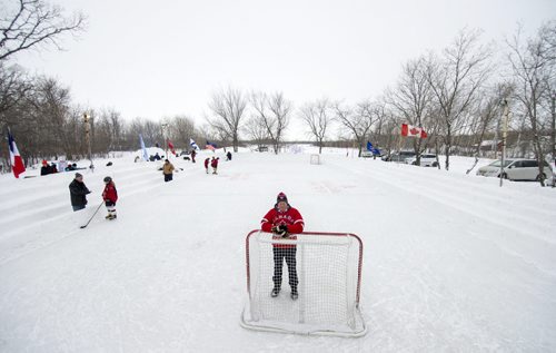 140118 Winnipeg - DAVID LIPNOWSKI / WINNIPEG FREE PRESS (January 18, 2014)  Bill Martens, 69, of McCreary Road in Charleswood has made a huge backyard hockey rink with seating for 1,000. He calls it the Charity Rink & Snow Bowl, and he is hosting games to fundraise for four charities. On Saturday the South Winnipeg Kings battled the Fort Garry Flyers.