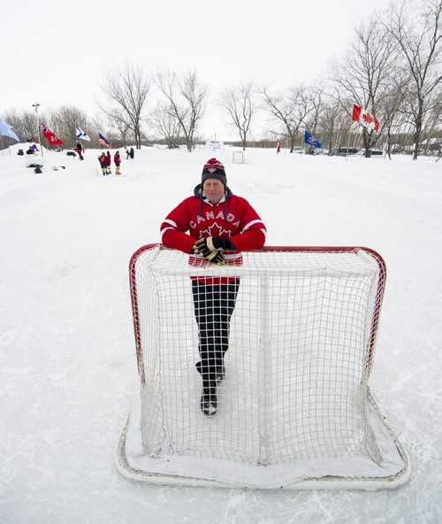 140118 Winnipeg - DAVID LIPNOWSKI / WINNIPEG FREE PRESS (January 18, 2014)  Bill Martens, 69, of McCreary Road in Charleswood has made a huge backyard hockey rink with seating for 1,000. He calls it the Charity Rink & Snow Bowl, and he is hosting games to fundraise for four charities. On Saturday the South Winnipeg Kings battled the Fort Garry Flyers.