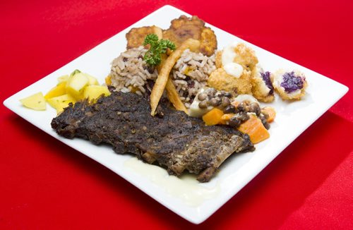 140117 Winnipeg - DAVID LIPNOWSKI / WINNIPEG FREE PRESS (January 17, 2014)  A rib meal made by owner of the Purple Hibiscus at the St. B Grill, Ave Dinzey. It's a Caribbean dining experience featuring flavours that take you back to "d' Islands".   Restaurant Review - Purple Hibiscus
