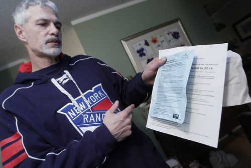 January 19, 2014 - 140119  - Larry Lagace of Laxdal Road shows the notice he received today when his water was shut off because of a water main break. Water crews were called to another water main break on Laxdal Road Sunday, January 19, 2014. John Woods / Winnipeg Free Press