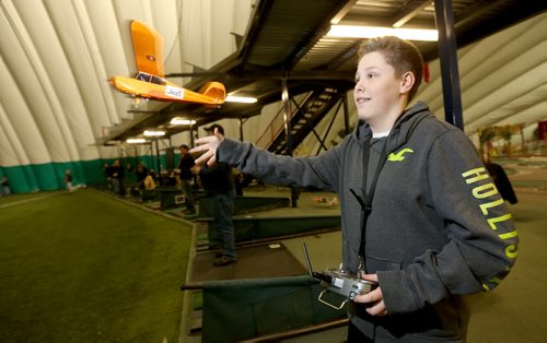 RC plane enthusiast, Camrin Chizick, 13, flying one of his planes at The Golf Dome, Friday, January 17, 2014. (TREVOR HAGAN/WINNIPEG FREE PRESS) - for dave sanderson story