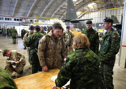 About 11 soldiers landed in Winnipeg at 17 Wing after serving several months on Canada's final commitment to Operation ATTENTION, Canada's contribution to the International Assistance Force / NATO Training Mission in Afghanistan. 140120 - January 20, 2014 MIKE DEAL / WINNIPEG FREE PRESS