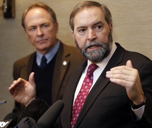 (right) Official Opposition Leader Tom Mulcair was at the Fairmont  Winnipeg in a very small room  for the second day of the NDPÄôs nationwide affordability tour .He took aim at ATM charges by banks and oil companies . Also with him was Winnipeg centre MP Pat Martin .JAN. 22 2014 / KEN GIGLIOTTI / WINNIPEG FREE PRESS