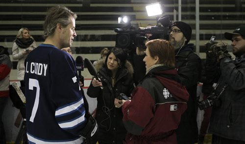Jim Cuddy, Blue Rodeo frontman and captian of the Juno Cup team The Rockers, talks to the media during the Juno Cup Training Camp at the MTS Iceplex Thursday morning. Former NHL greats and some Canadian music legends took to the ice at the MTS Iceplex for the Juno Cup Training Camp Thursday morning. The Juno Cup is a celebrity charity hockey game that takes place prior to the Juno Awards and pits former NHL stars and some of Canada's fearless musicians. 140123 - Thursday, January 23, 2014 -  (MIKE DEAL / WINNIPEG FREE PRESS)