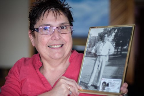 Debbie Scott is one of 2,600 people in Manitoba who got their Indian Status back after Ottawa reformed legislation that discriminated against aboriginal women who married white men. She is holding a photo of her father who lost his status because his mother, Debbie's grandmother, was white and married an aboriginal man. In the bottom of the portrait of her father is Debbie's Indian Status card. 140123 - Thursday, January 23, 2014 -  (MIKE DEAL / WINNIPEG FREE PRESS)