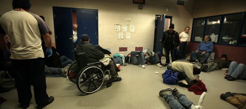 Clients wait in the Main Street Project for mats to be laid out on the floor to sleep on Thursday evening. See Randy Turner's tale re: Homelessness.  January 23, 2014 - (Phil Hossack / Winnipeg Free Press)