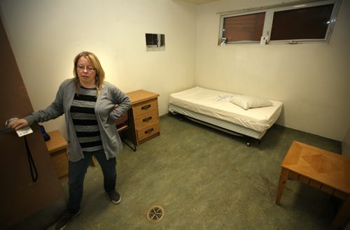 Main Street Project Executive Director Lisa Goss shows of a transitional housing room at the facility Thursday evening. See Randy Turner's tale re: Homelessness.  January 23, 2014 - (Phil Hossack / Winnipeg Free Press)