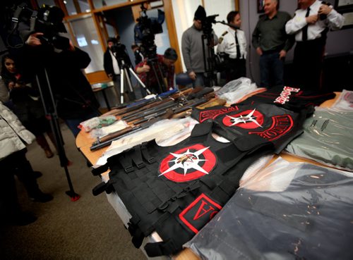 "Ballistic" armored vests sit on display of confiscated  weapons, amunition and and guns taken from the Manitoba Warriors by police. The evidence was shown off today at the morning police media briefing. See story. January 24, 2014 - (Phil Hossack / Winnipeg Free Press)